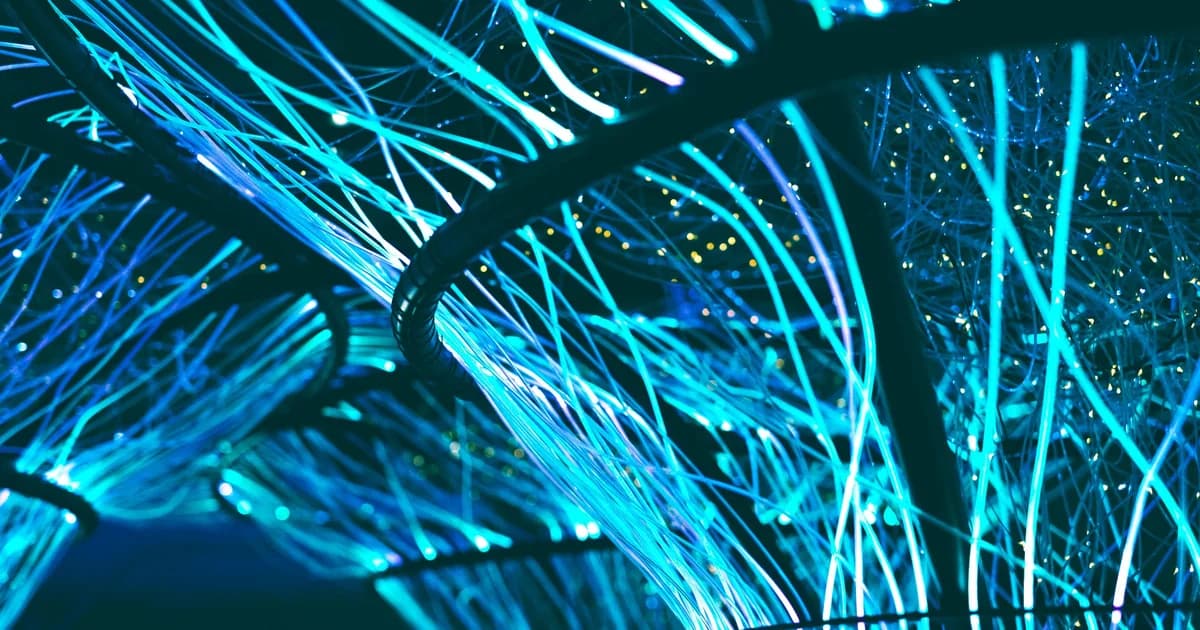 Representational image: a network of glowing blue fiber-optic strands, symbolizing a hash table with bucket chains