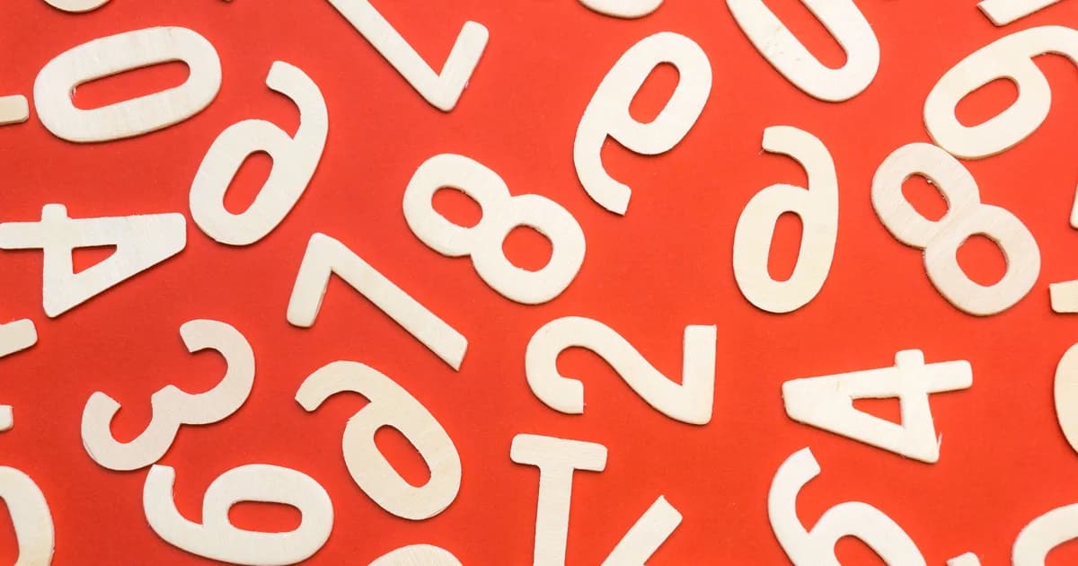 Representational image: scattered numerals on a red background, symbolizing sorted numbers searched with binary search