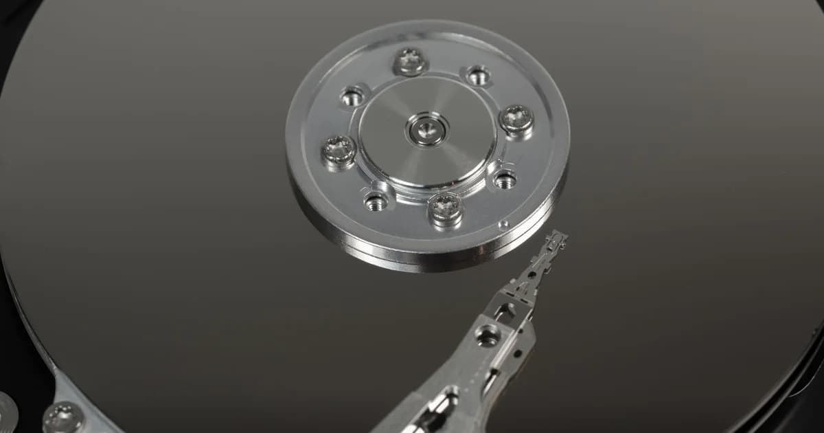 Representational image: a macro shot of a hard drive's platter and read/write arm, symbolizing reading data by page chunks