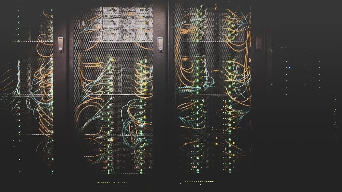Rows of illuminated server racks in a modern data center, representing caching infrastructure