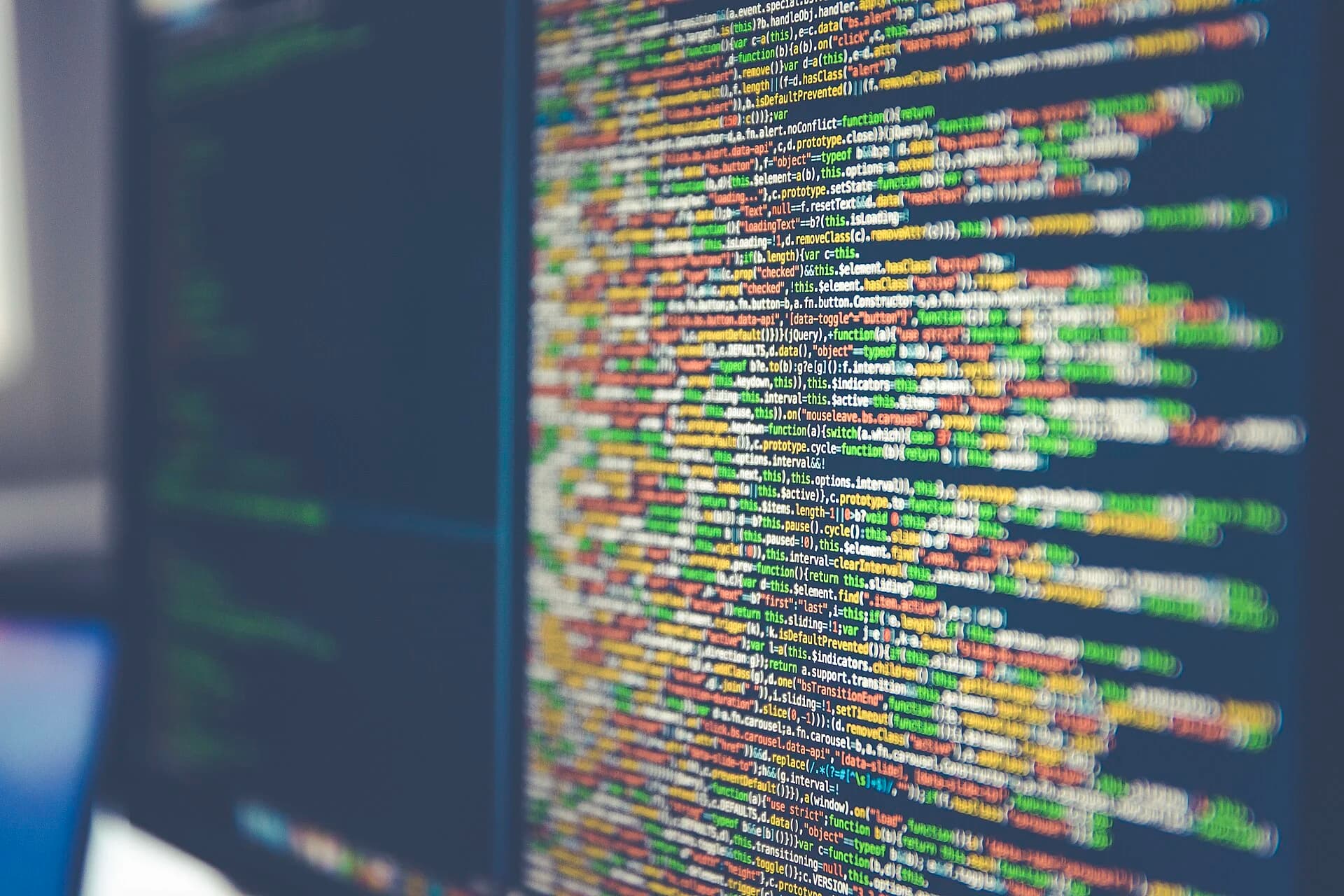 Colorful code on a computer monitor, symbolizing the SQL statements you are about to learn to write